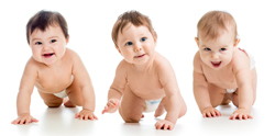 A picture of three babies crawling