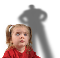 A picture of a young girl looking up at a scary figure, we can see the shadow of a large figure