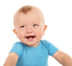 A photograph of a baby boy smiling