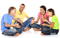 A picture of a Family sat down together talking