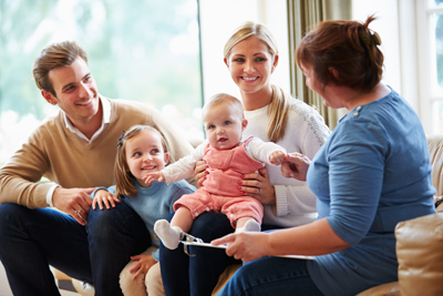 A picture of a family talking in a meeting