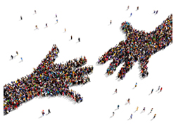 A picture of a group of people standing together making a hand symbol